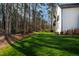Well-maintained backyard with a grassy lawn, providing ample space for outdoor activities and enjoyment at 6816 Rainwater Rd, Raleigh, NC 27615