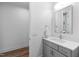 Bright bathroom featuring a vanity with gray cabinetry and a gray countertop at 6816 Rainwater Rd, Raleigh, NC 27615