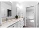Bright bathroom with double sinks and a plant and a separate water closet, perfect for Gathering use at 6816 Rainwater Rd, Raleigh, NC 27615