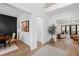 Bright foyer with hardwood floors, an open layout, and a view into the dining and living spaces at 6816 Rainwater Rd, Raleigh, NC 27615