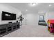 Spacious living area with a large entertainment center, plush seating and room to play at 6816 Rainwater Rd, Raleigh, NC 27615
