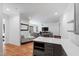 Hardwood floors and sightlines from the living room to the kitchen in this luxurious open floor plan at 6816 Rainwater Rd, Raleigh, NC 27615