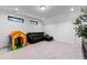 Cozy second-floor bonus room for relaxing or entertaining with an accent tree and modern touches at 6816 Rainwater Rd, Raleigh, NC 27615