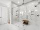 Luxurious walk-in shower with marble surround and glass enclosure at 6816 Rainwater Rd, Raleigh, NC 27615