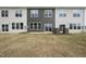 Townhome backyard features a green lawn, gray siding, and an outdoor patio at 88 Ripple Way # 314, Clayton, NC 27520