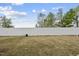 Spacious backyard with a well-maintained lawn and a white privacy fence at 88 Ripple Way # 314, Clayton, NC 27520