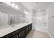 Spacious bathroom with double sinks, large mirror, and a bathtub at 88 Ripple Way # 314, Clayton, NC 27520