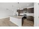 Modern kitchen boasts stainless steel appliances, granite counters, and a central island at 88 Ripple Way # 314, Clayton, NC 27520