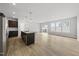 Open-concept kitchen featuring an island that connects to a bright, spacious living area at 88 Ripple Way # 314, Clayton, NC 27520