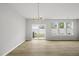 Bright living room with sliding doors leading to the backyard and wood flooring at 88 Ripple Way # 314, Clayton, NC 27520