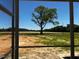 Backyard seen through the screens of a porch at 896 Olive Branch Dr, Smithfield, NC 27577