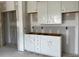 Unfinished bathroom with white cabinets and drawers, and space for a double sink at 896 Olive Branch Dr, Smithfield, NC 27577