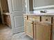 Bathroom vanity featuring natural wood cabinets, light countertops and chrome hardware at 896 Olive Branch Dr, Smithfield, NC 27577