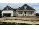 New construction home featuring white siding, dark roof, and a covered porch at 896 Olive Branch Dr, Smithfield, NC 27577