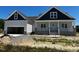 Charming home featuring a two-car garage, covered porch, and classic architectural details at 896 Olive Branch Dr, Smithfield, NC 27577