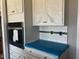 The kitchen features white cabinets, modern appliances, and subway tile backsplash at 896 Olive Branch Dr, Smithfield, NC 27577