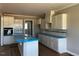 The kitchen boasts white cabinets, a center island, and modern appliances at 896 Olive Branch Dr, Smithfield, NC 27577