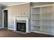 Cozy fireplace with built-in bookshelves in the living room at 896 Olive Branch Dr, Smithfield, NC 27577