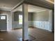 Bright living room featuring decorative columns and stylish wainscotting at 896 Olive Branch Dr, Smithfield, NC 27577