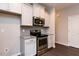 This kitchen features granite countertops, stainless steel appliances, and sleek, modern cabinets at 1007 Drew St, Durham, NC 27701