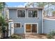 Two story home featuring a backyard patio and blue siding at 1016 N Bend Dr, Raleigh, NC 27609