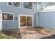View of home with blue siding and sliding glass door to the back patio at 1016 N Bend Dr, Raleigh, NC 27609