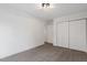 Bedroom with neutral carpet, white walls, and double closet doors at 1016 N Bend Dr, Raleigh, NC 27609