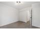 Bright bedroom with neutral carpet, white walls, and closet at 1016 N Bend Dr, Raleigh, NC 27609