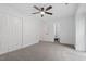 Bright bedroom with carpet, a ceiling fan, and access to an attached bathroom at 1016 N Bend Dr, Raleigh, NC 27609