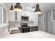 Modern kitchen featuring stainless steel appliances, white cabinets, and bright countertops at 1016 N Bend Dr, Raleigh, NC 27609