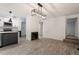 Open-concept living space with modern flooring, connecting kitchen, dining, and living areas at 1016 N Bend Dr, Raleigh, NC 27609