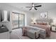 Serene main bedroom with a plush bed, soft lighting, and a balcony view at 1016 N Bend Dr, Raleigh, NC 27609