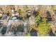 Discover an aerial view of the property nestled amongst mature trees and a neighborhood at 104 Seaman St, Oxford, NC 27565