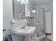 Bathroom featuring a pedestal sink and a shower with glass door and chrome finishes at 104 Seaman St, Oxford, NC 27565