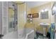 Cozy bathroom features a tub and shower unit with a charming pedestal sink at 104 Seaman St, Oxford, NC 27565