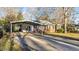 Charming single-Gathering brick home featuring a convenient covered carport and well-kept lawn at 104 Seaman St, Oxford, NC 27565