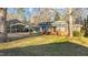 Charming brick home featuring a large front yard and convenient carport at 104 Seaman St, Oxford, NC 27565