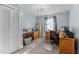 Bright home office featuring a large desk, ample storage, and natural light from the window at 104 Seaman St, Oxford, NC 27565