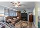 The spacious living area includes a ceiling fan, large sofa, and decorative furnishings at 104 Seaman St, Oxford, NC 27565