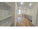 Hallway with hardwood floors and access to rooms at 105 Leisure Ln, Louisburg, NC 27549
