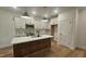 Modern kitchen with a marble island, stainless steel appliances, and ample cabinet space at 105 Leisure Ln, Louisburg, NC 27549