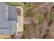 Aerial view of home with wooden patio deck featuring table and seating, and nearby hot tub at 105 Mystic Quartz Ln, Holly Springs, NC 27540