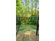 Backyard gate leading to a wooded, private outdoor area at 105 Mystic Quartz Ln, Holly Springs, NC 27540