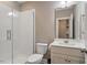 Modern bathroom with tiled shower, white vanity and sink, and neutral color scheme at 105 Mystic Quartz Ln, Holly Springs, NC 27540