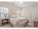 Cozy bedroom features natural light from two windows and carpeted floors at 105 Mystic Quartz Ln, Holly Springs, NC 27540