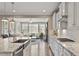 This gourmet kitchen showcases an open design and features granite countertops at 105 Mystic Quartz Ln, Holly Springs, NC 27540