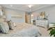 Spacious Primary bedroom with ensuite bath, tray ceiling, and neutral color palette at 105 Mystic Quartz Ln, Holly Springs, NC 27540