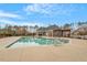 Community pool with handicap lift, lounge furniture and pergola with seating area at 105 Mystic Quartz Ln, Holly Springs, NC 27540