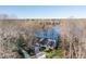 Aerial view showcasing home with a lakefront location at 106 Nashua Cv, Louisburg, NC 27549