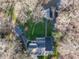 Aerial view of lakefront home with large yard and deck overlooking water at 106 Nashua Cv, Louisburg, NC 27549
